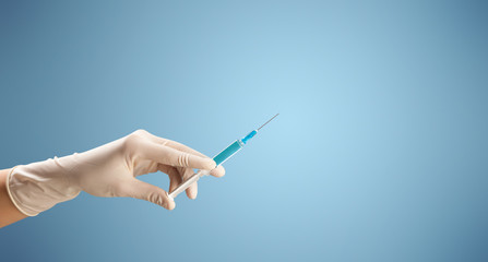 Female doctor holding syringe