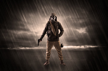 Naklejka premium Terrorist in a room with weapons on his hand