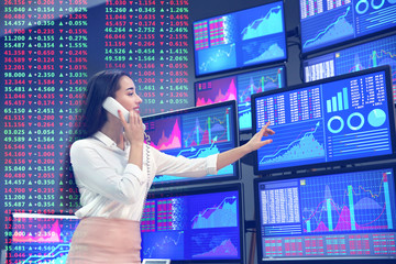 Female stock trader working in office