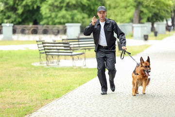 Security guard with dog in park