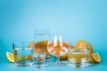 Transparent water in different glasses