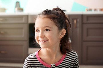 Cute little girl in kitchen