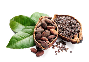Halves of ripe cocoa pod with beans and nibs on white background - obrazy, fototapety, plakaty
