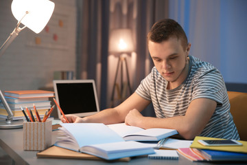 Student doing homework indoors late at night