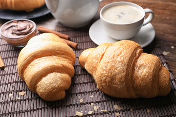 Tasty croissants on table, closeup