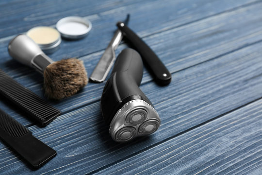 Shaving accessories for man on wooden background