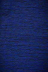 Blue Indigo knitted wool texture background pattern vertical background. Selective focus. Top view. Copy space.