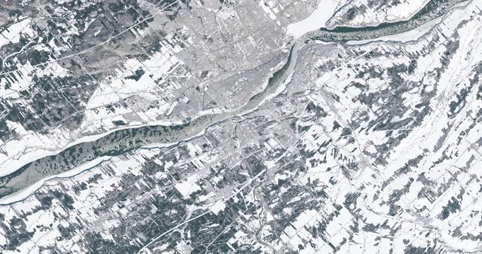 Very high-altitude overflight aerial of Quebec City, Canada, in winter. Clip loops and is reversible. Elements of this image furnished by USGS/NASA Landsat