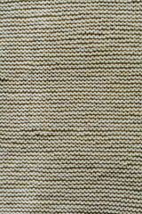 Beige knitted wool texture background pattern vertical background. Selective focus. Top view. Copy space.