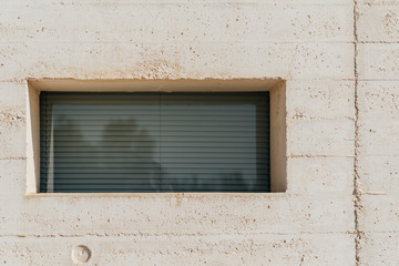 Full frame of window on white concrrete wall