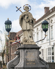 Fototapeta premium St. John of Nepomuk statue on bridge, Brugge, Belgium