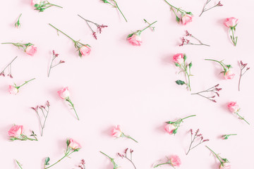 Flowers composition. Frame made of pink rose flowers on pink background. Flat lay, top view, copy space, square