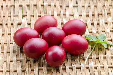 Closeup paint Easter red eggs on wicker table, Sofia, Bulgaria 