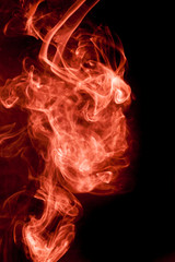 Red smoke on a black background.