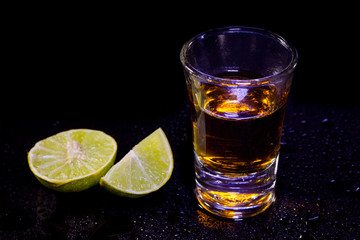 One shots whiskey with lime.