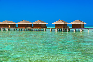Bungalows on tropical Maldives island
