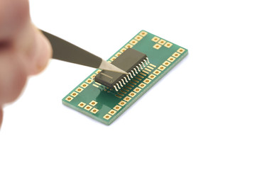 Insert microchip memory into adapter SMD twith tweeze
