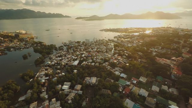 Aerial view Coron city with slums and poor district. Palawan. Busuanga island. Evening time and sunset.