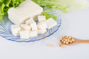 Closeup of Tofu and Soybeans. Soybeans and tofu are a good source of protein and a serious food allergen.