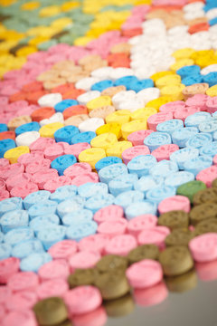 Detail of pills of MDMA (Extasy) distributed by drug dealer seized by legal authority