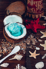 Blue ice cream in coconut bowl.