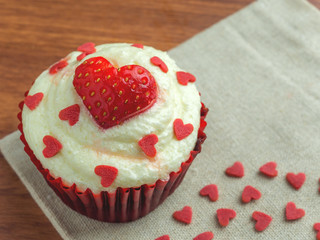 Close-up image of red velvet strawberry cup cake with heart shape sugar, Valentine concept, Copy space