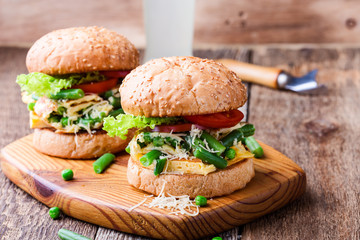 Egg omelet burgers with  green beans and peas
