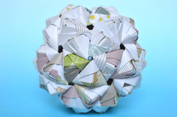 Modular origami, sonobe ball, on blue background