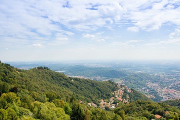 Beautiful mountain landscape. Top view of the mountain to a small town. Viewpoint from the top of Brunate. Italy.  Views of landscape from the Lighthouse named Alessandro Volta.