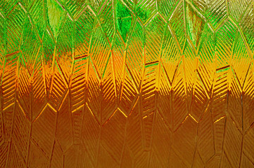 Obraz premium Multicolored background texture of glass. Green, yellow, brown grinding glass color.