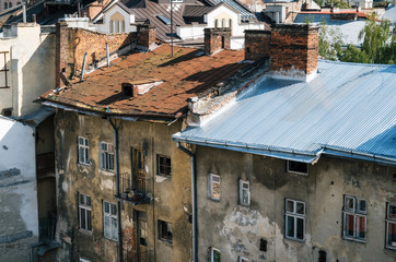 Fototapeta na wymiar Old ramshackled roofs of houses of Lviv, Ukraine.