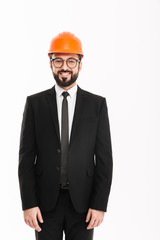 Cheerful builder engineer wearing helmet.