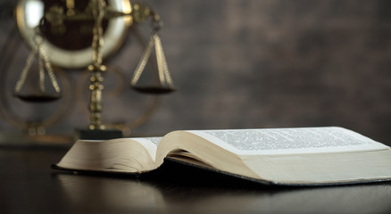 Law and Justice concept. Brown wooden background