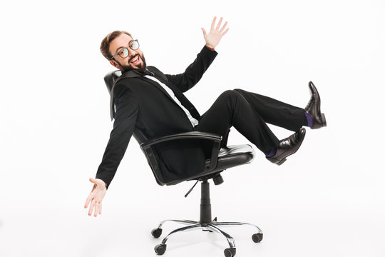 Cheerful businessman sitting isolated