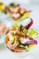 Delicious shrimp cocktail with avocado and lettuce.