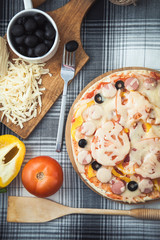 delicious homemade pizza on the table. Grated cheese and olives Menu, restaurant recipe concept. top view