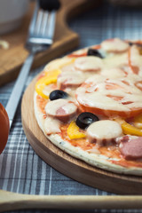 delicious homemade pizza on the table. Grated cheese and olives Menu, restaurant recipe concept