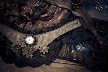 A beautiful still-life in the steampunk style with protective goggles and accessories of women's clothing.