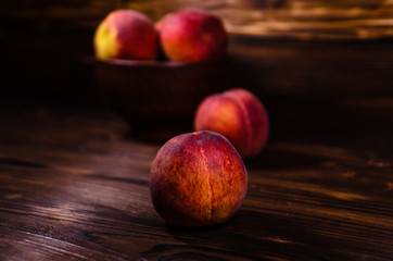 Fresh ripe peaches on wooden table