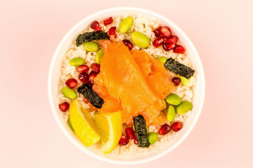 Food Bowl Of Smoked Salmon With Rice Edamame beans Seaweed and Pomegranate Seeds