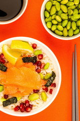 Food Bowl Of Smoked Salmon With Rice Edamame beans Seaweed and Pomegranate Seeds