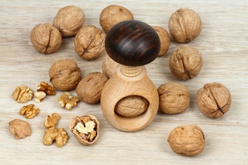 Wooden nutcracker in mushroom  shape  & walnuts