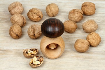 Wooden nutcracker in mushroom  shape  & walnuts
