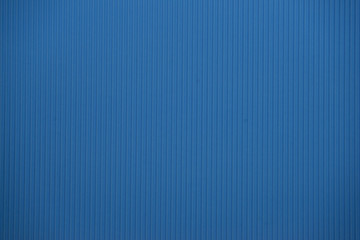Light blue colored corrugated cardboard texture useful as a background