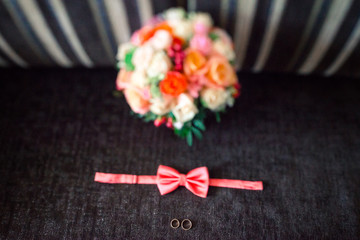 Obraz na płótnie Canvas Wedding accessories. Bouquet and accessories of bride and groom. Wedding details