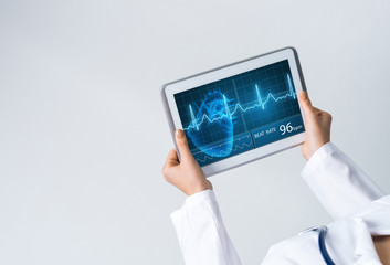Close of female doctor hands working with tablet pc computer