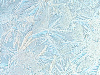 Winter background, frost on window. Ice frosty patterns on winter glass. Ice crystals