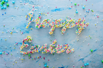 Words Happy Easter made of colorful candies