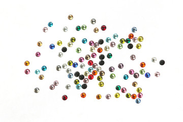 Many strewn with multi-colored rhinestones.