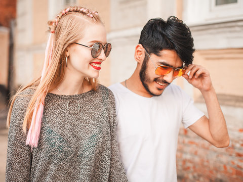 Asian Guy And Woman Are Walking On The Street